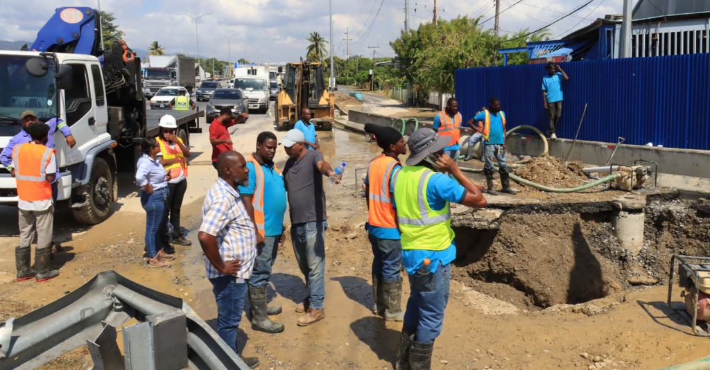 WASA employees on site at the Curepe Interchange along the Churchill Roosevelt highway on March 14 after a water main burst, causing supply issues from Oropune Gardens to St Ann’s. - Photo by Roger Jacob