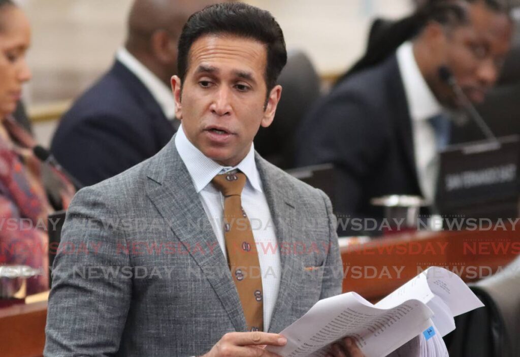 Minister of Rural Development and Local Government Faris Al-Rawi, prepares to debate in Parliament on April 23. - Photo by Angelo Marcelle