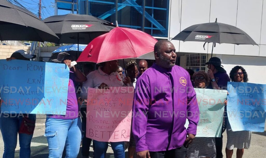 FLASHBACK: President of the TT Postal Workers Union Shellon Trim leads a protest outside TTPost’s corporate shop, Caroline Building, Wilson Road, Scarborough in Tobago on March 13. - File photo by Corey Connelly