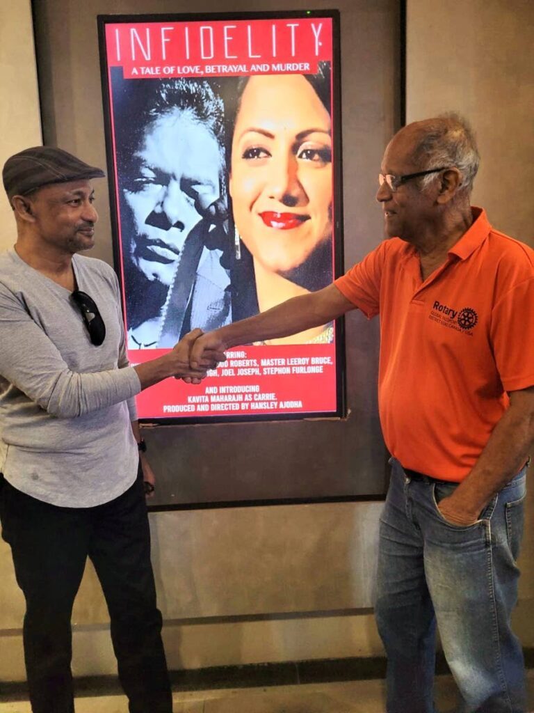 Actor, director and producer Hansley Ajodha, left, greets veteran actor Kenneth Boodhu following a screening of Ajodha's film Infidelity at Gemstone, CinemaOne, One Woodbrook Place, Port of Spain. - 