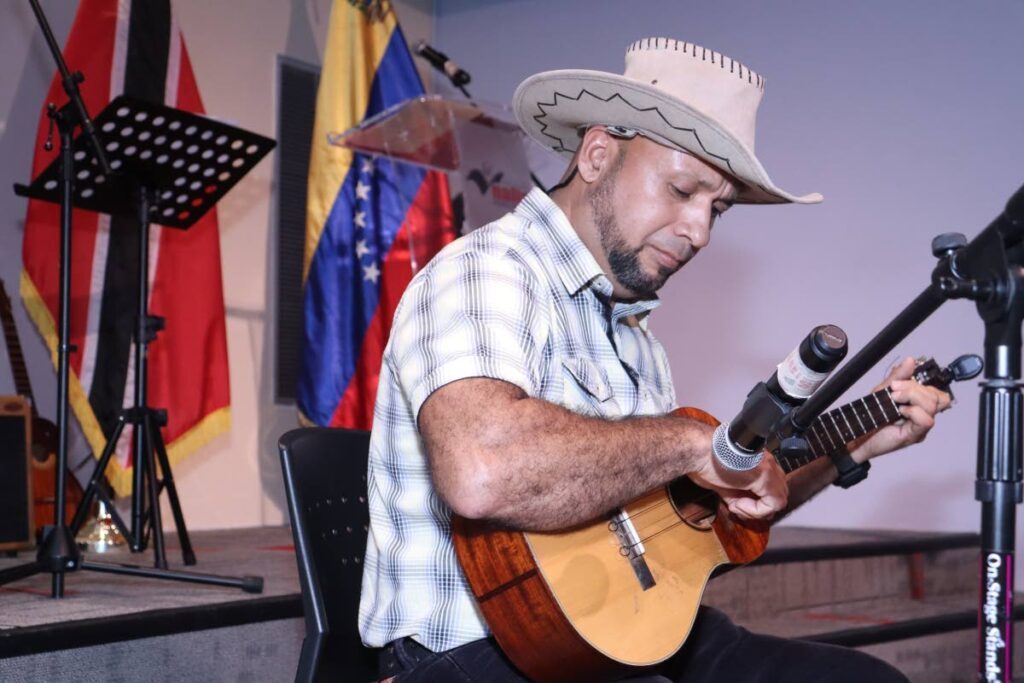Cuatrista Rodolfo Pereira, director of the Venezuelan music group Nuevas Raíces, performs during National Day of the Venezuelan Cuatro on April 4 at Nalis, Port of Spain.
 - GREVIC ALVARADO