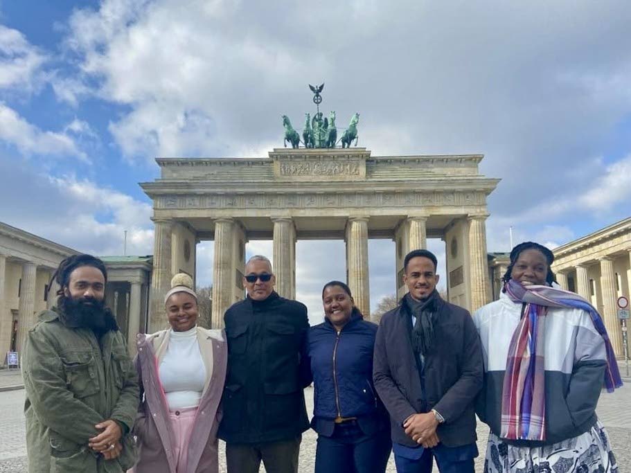 Representatives at Berlin's Brandenburg Gate, Faraaz Abdool,  Trinidad, left; Meghyn Fountain, Bahamas; Phillip Robinson, Tobago; Jenela Auguste, St Lucia; Osbourne Chin, Jamaica;  and Sibongile Dickson, Grenada. - 