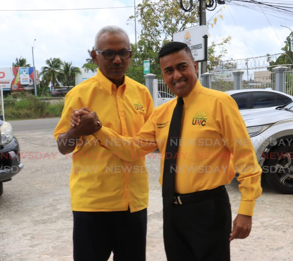 UNC chairman Davendranath Tancoo, right, and Couva South MP Rudranath Indarsingh after they filed nomination papers to be considered as candidates for the next general elections at the UNC headquarters, in Chaguanas on April 11. - ROGER JACOB