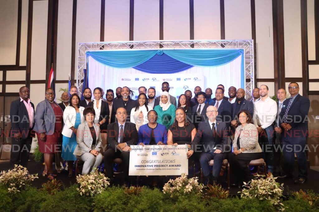 Groupshot of all the recipients of this year's grants distributed by the Ministry of Planning and Development at Hilton Conference Centre, Port of Spain on April 11. - Photo by Venessa Mohammed