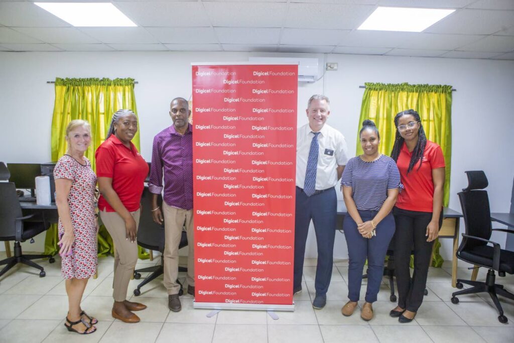 Diane Sellers, humanitarian missionary for Latter-day Saint Charities (LDSC), left; Natalie-Anne De Silva, project consultant at the Digicel Foundation; Robert Ward, addiction counselor at the New Life Ministries Rehabilitation Centre; Kory Sellers, humanitarian missionary for LDSC; Patrice Dookie, therapist at the New Life Ministries Rehabilitation Centre and Misha Jackman, finance accountant at the Digicel Foundation, at the launch of the tech space at the New Life Ministries Rehabilitation Centre in Palo Seco.
Photo courtesy Digicel Foundation. - 