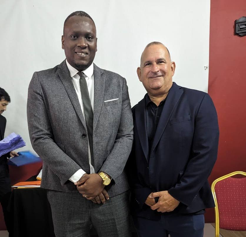 Kieran Edwards, left, newly elected president of the TT Football Association, with former chairman of the FIFA-appointed normalisation committee Robert Hadad, at the Home of Football, Couva on April 13. - 
