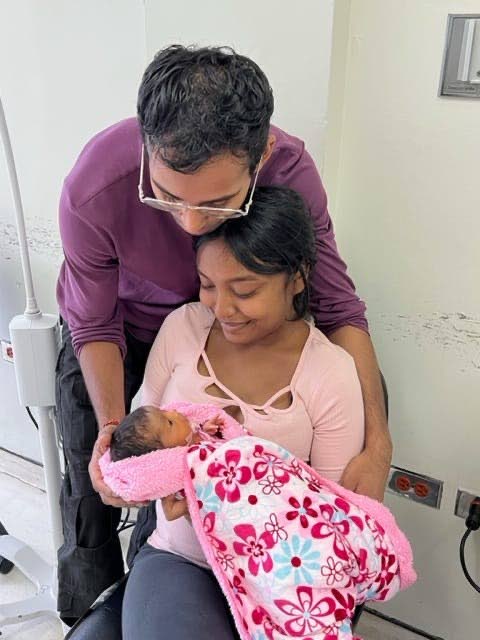Avinash Chattergoon and Daynelle Samaroo cuddle their baby Aarya before her death on April 5 at the Port of Spain General Hospital. - 