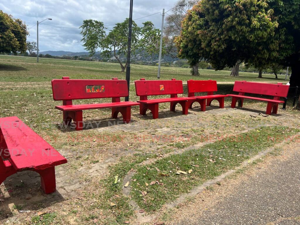 Benches painted red as part of the I Love My Street initiative at the Queen's Park Savannah, Port of Spain. - Photo by Enrique Rupert