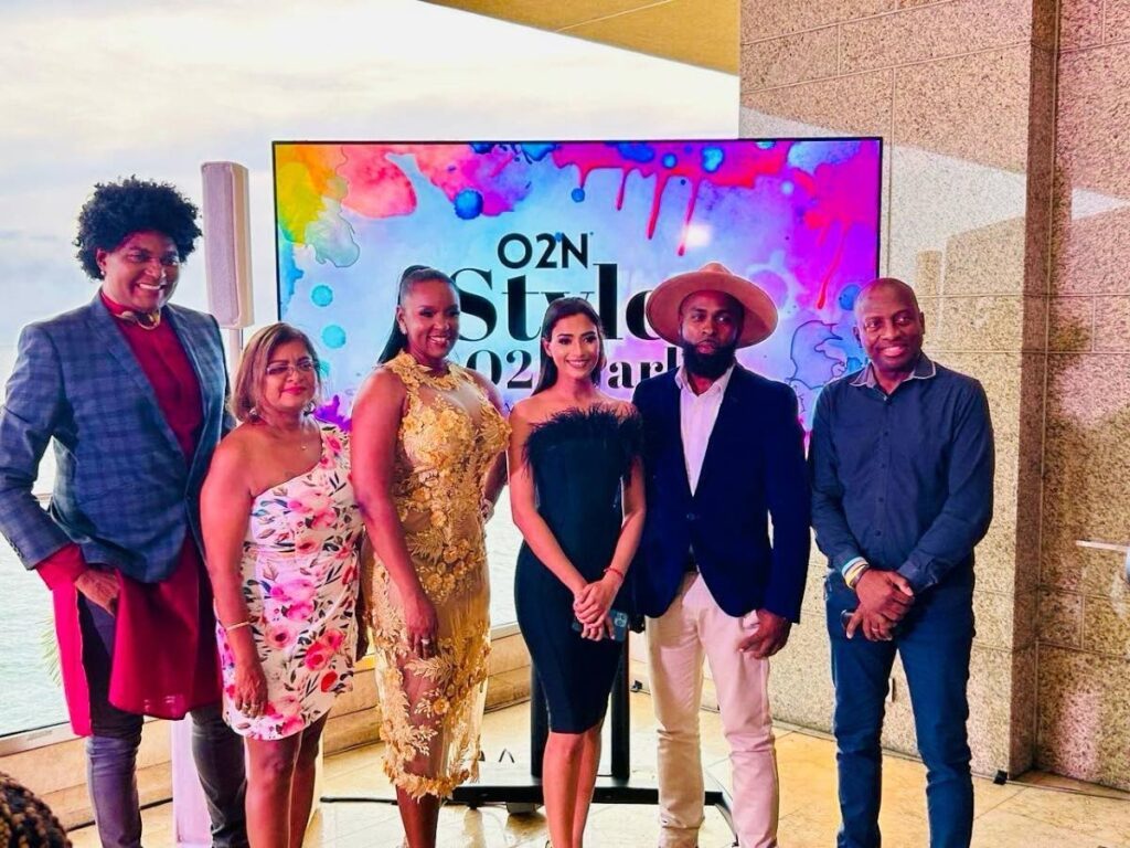 Richard Young, left, and Nicole Dyer-Griffith, third from left, and guests at the launch of the O2N Foundation's O2N Style at O2 Park at the Hyatt Regency, Port of Spain.  - 