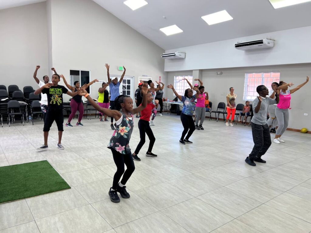 Fitness enthusiasts of all ages eagerly take part in aerobics sessions.  - 