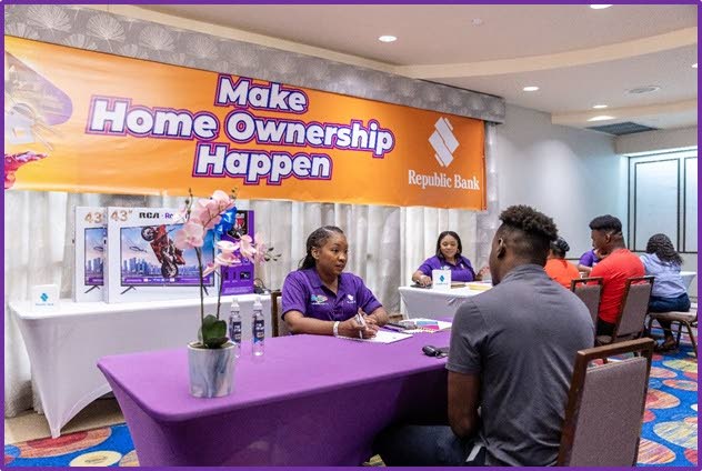 Republic Bank mortgage specialist gives advice to a potential homeowner at its Make Homeownership Happen event on April 13.
Photo courtesy Republic Bank - 
