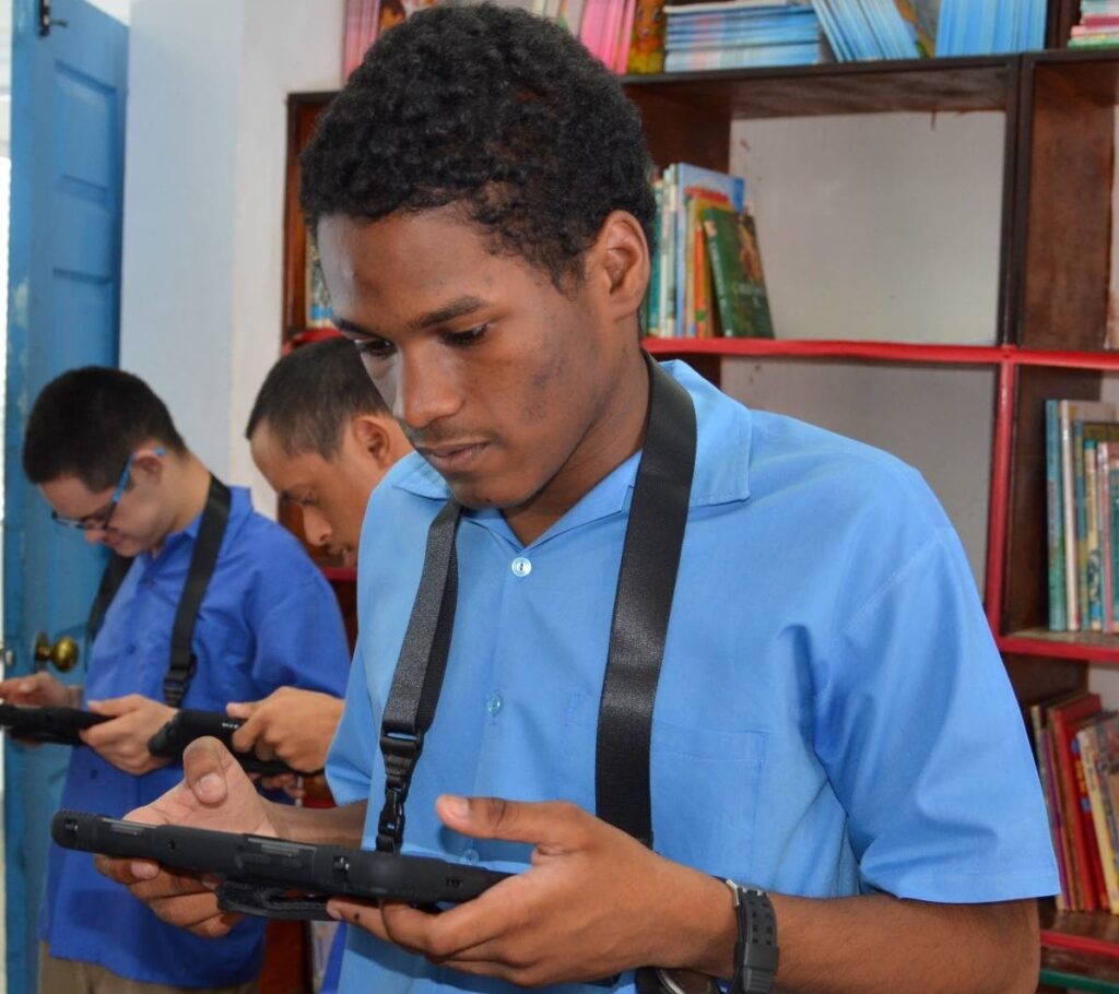 Immortelle Centre students use the devices donated to the school through the IGT After School Advantage programme. - Photo courtesy IGT