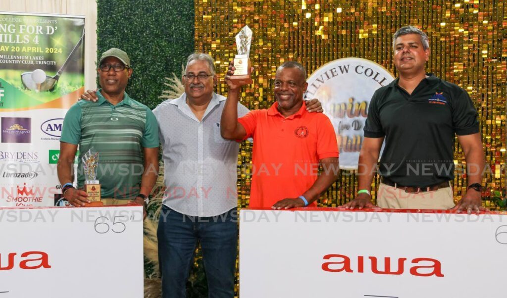 Swing for D Hills champions Richard Lara, left, and Wayne Baptiste, second from right, collect their first prize from Hillview College acting principal Derek Bissessar, second from left, and Arvind Ramsaran of sponsor St Augustine Medical Laboratory Ltd. at the Swing for D Hills prize-giving function on April 20 at Millennium Clubhouse, Trincity. - Photo by Daniel Prentice 