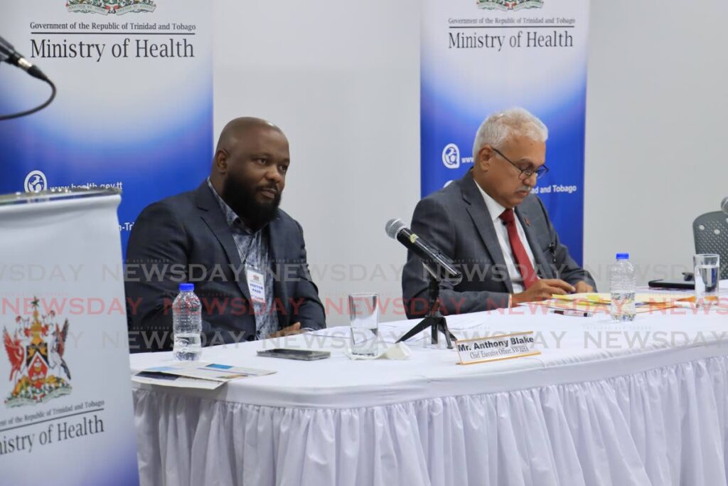 Health Minister Terrence Deyalsingh, right and NWRHA CEO Anthony Blake at a media conference at the Ministry of Health's head office, Queen's Park East, Port of Spain, on April 22. - Photo by Venessa Mohammed
