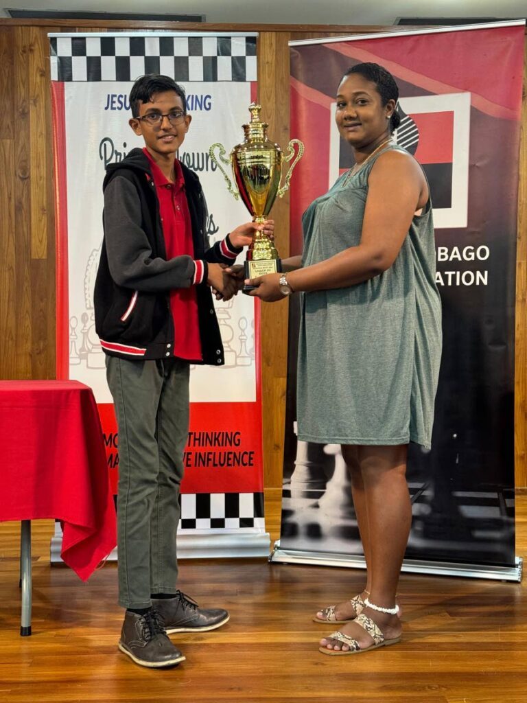 Kael Samuel Bisnath receives his award after capturing the 2024 TT Junior Blitz Chess Championship in San Fernando on April 5. - Photo courtesy TTCA