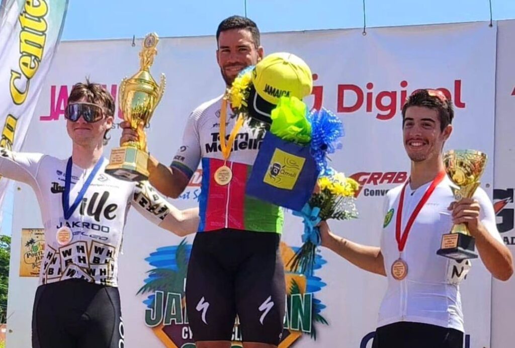 TT cyclist Liam Trepte, right, celebrates his stage three third place finish at the Jamaica International Cycling Classic on April 7. From left are second placed American Preston Eye and stage Colombian winner Christian Saavedra.  - Photo courtesy TTCF