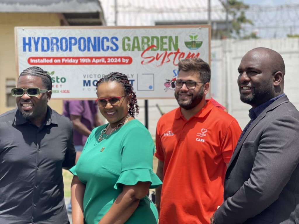  Akeem “Preedy” Chance, soca artiste, left, Kyrla Roberts, principal, Maloney Government Primary School, Jean- Luc Mouttet, Presto business development director and Stephan Wattley, councillor for Mausica/Maloney. - 