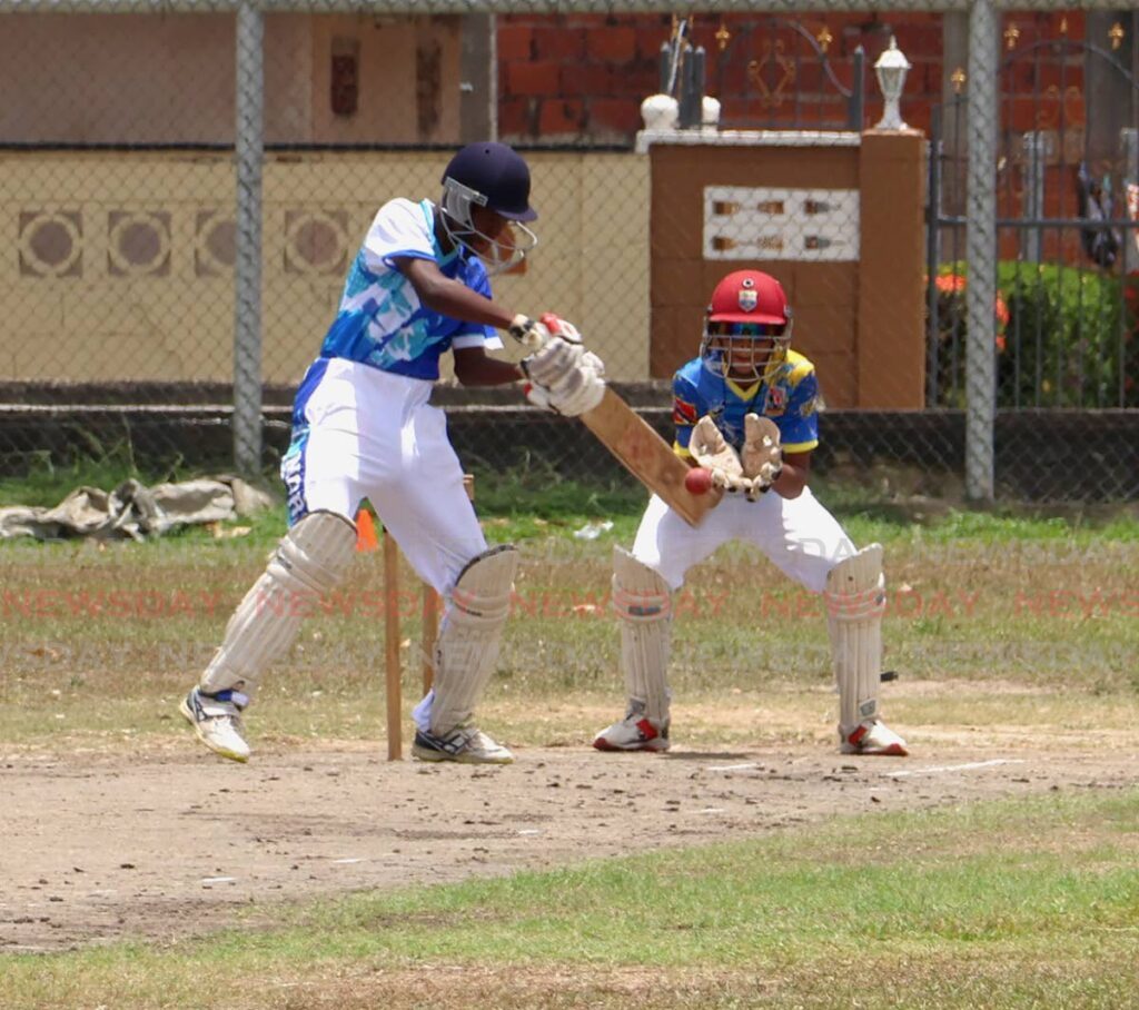 North Zone batsman Larell Guiseppi attempts a cut shot during the TT Cricket Board Interzone Under-13 tournament at Knowles Street Recreation Grounds in Curepe on April 24. East wicket-keeper Rayhan Gooding is waiting for a catch. - Photo by Roger Jacob