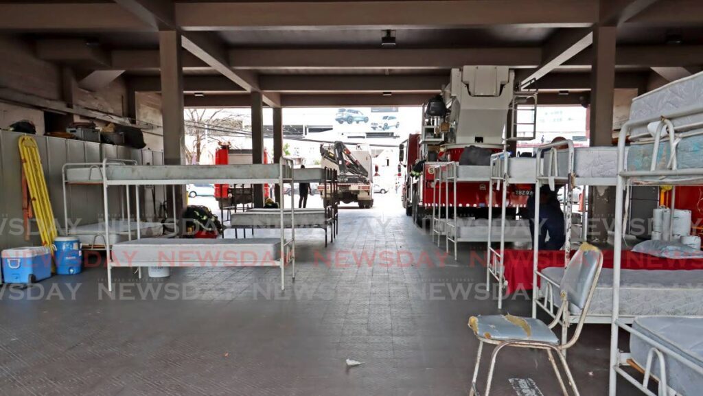 TT Fire Service officers stationed at its Wrightson Road Headquarters have moved their beds from their male dormitory to the appliance bay in protest against a lack of air conditioning in the dorm on April 24. - File photo by Venessa Mohammed