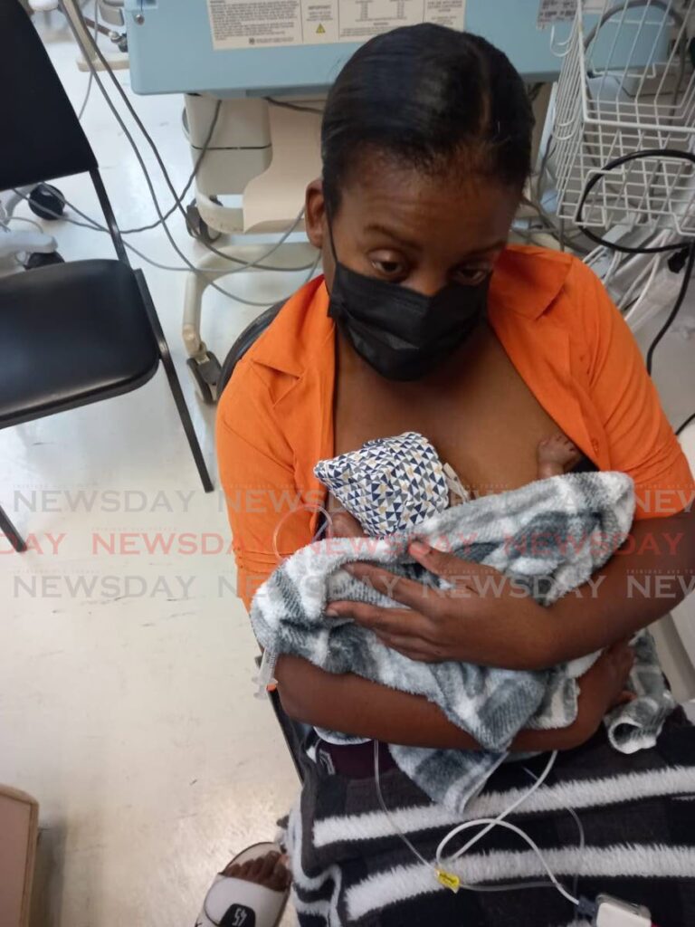 Makeda Roberts and her newborn baby boy, Ekon Marcelle in 2022. - 