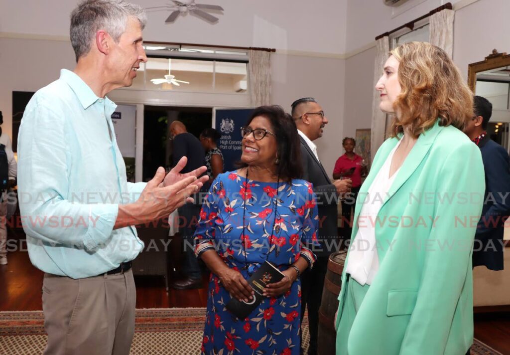 Trade Minister Paula Gopee-Scoon, centre, speaks with director of corporate relations of Twinings, Stephen Twining and UK High Commissioner Harriet Cross during the Great British Food and Drink event on April 24. - AYANNA KINSALE