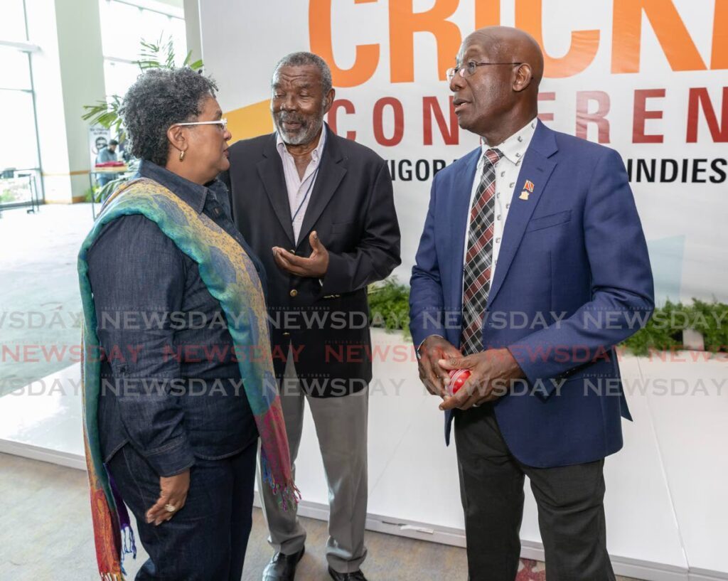 Trinidad and Tobago Prime Minister Dr Keith Rowley (R) wpeaks with Barbados prime minister Mia Mottley (L) and former West Indies cricketer Sir Charles Griffith at the Caricom Regional Cricket Conference held at the Hyatt Trinidad, Port of Spain on April 25. - Photo by Jeff K. Mayers
