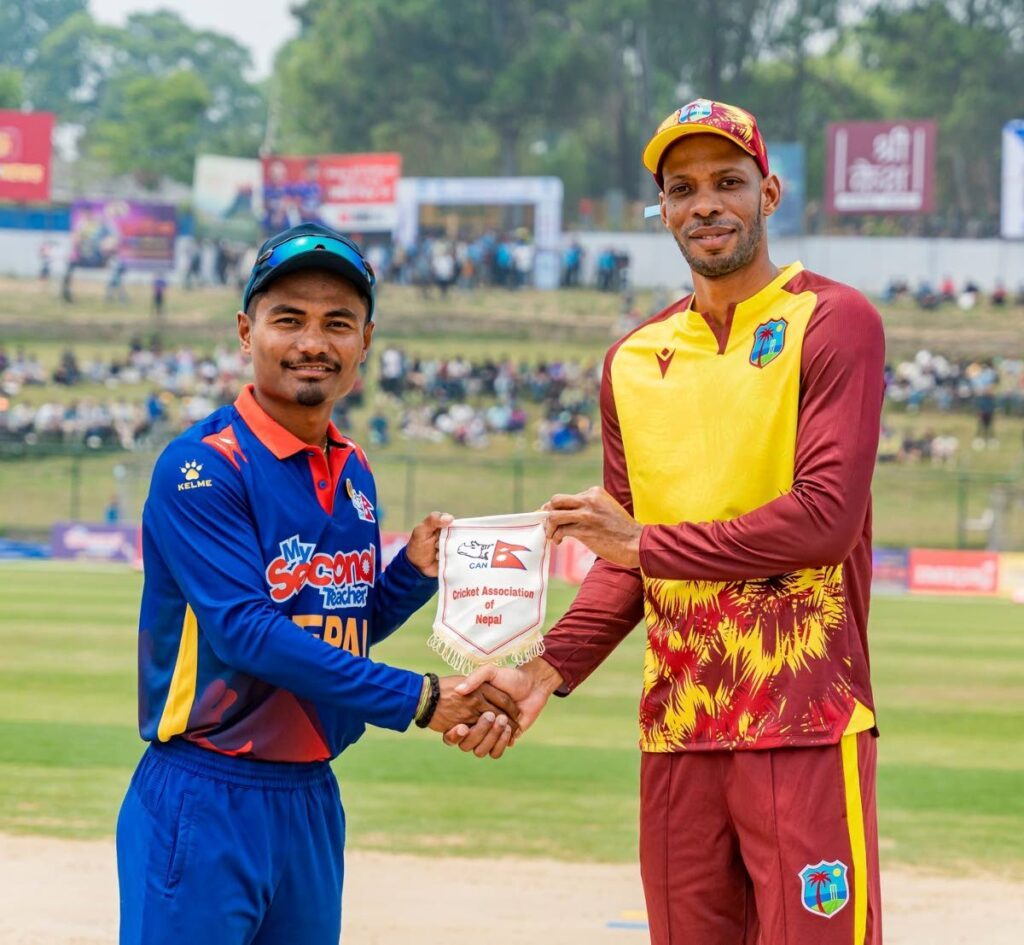 West Indies A captain Rostan Chase (R) and Nepal skipper Rohit Paudel greet each other at before the start the first T20 match, at the Tribhuvan University International Cricket Ground, on Saturday. - Phot courtesy the Nepal Cricket Association