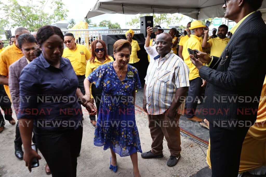 Political leader of the UNc Kamla Persad Bissessar arrives at the UNC's 35th anniversary celebration at the party’s headquarters in Chaguanas on Sunday. - Lincoln holder 
