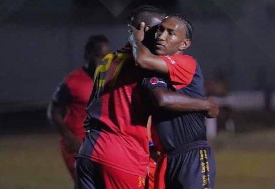 AC PoS playmaker John-Paul Rochford, right, celebrates a goal with a teammate. - File photo