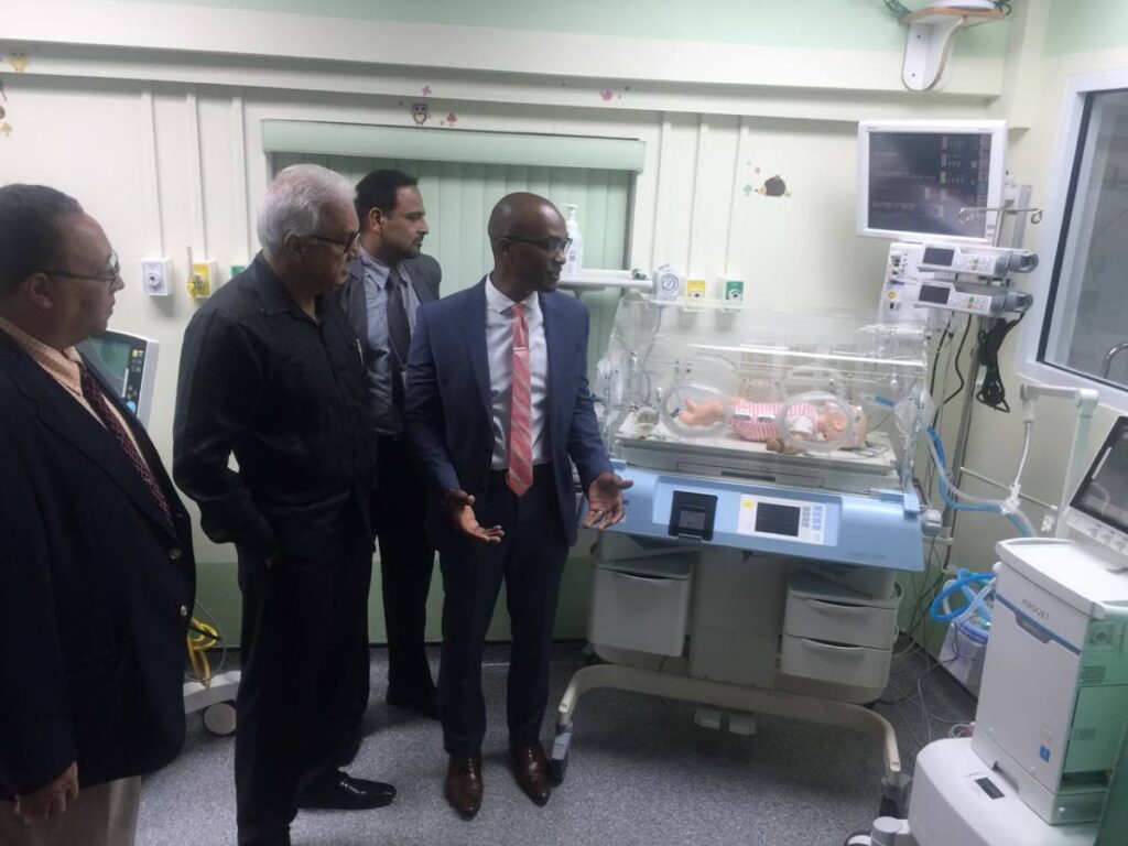 In this 2018 file photo, Health Minister Terrence Deyalsingh, second from left, with officials of the Eastern Regional Health Authority look at equipment in the neonatal unit of the Sangre Grande Hospital.  - 