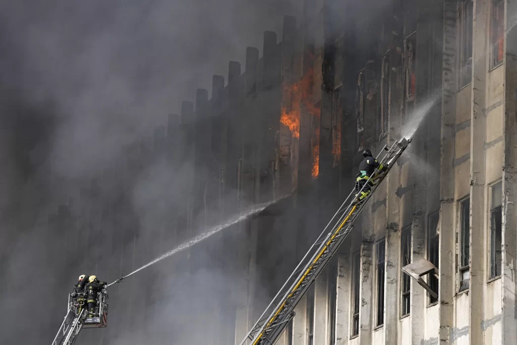 Firefighters tackle a blaze at the site of a Russian attack in Kharkiv, Ukraine. AP PHOTO - 