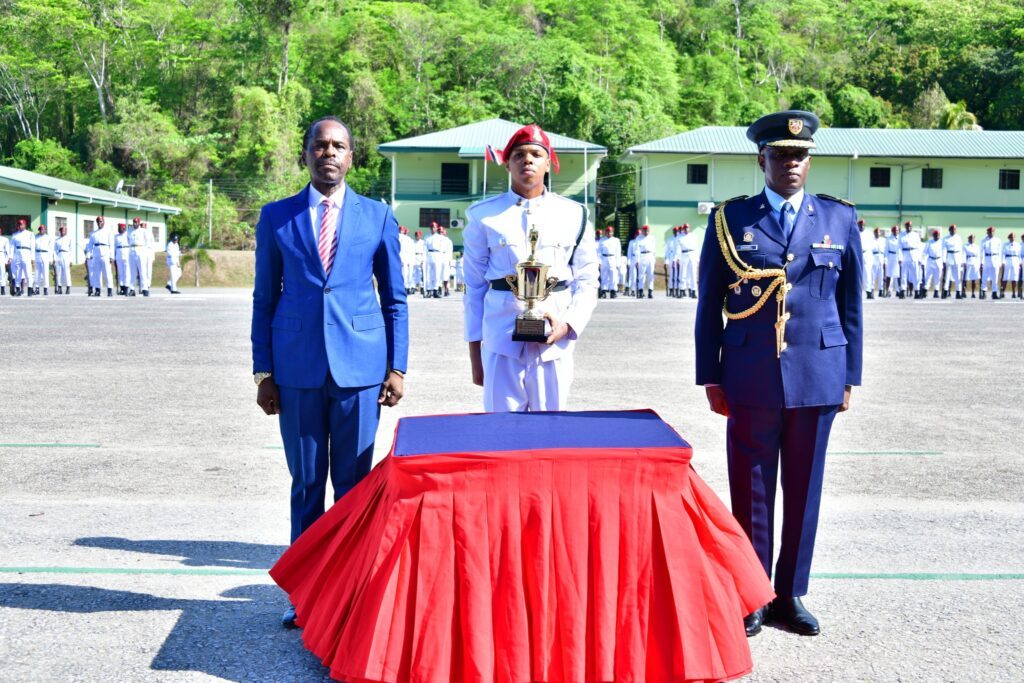 From left, National Security Minister Fitzgerald Hinds, TTDF reserves recruit Keevyn Roberts who received the best male recruit of intake 2301 award and Chief of Defence Staff Air Vice Marshal Darryl Daniel - Photo courtesy the National Security Ministry's Facebook page