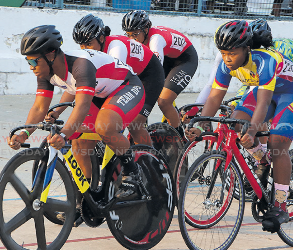 Riders compete in the International Ladies two-lap race at the TT
Cycling Federation Easter Grand Prix, Arima Velodrome, on March 30. - Photo by Angelo Marcelle