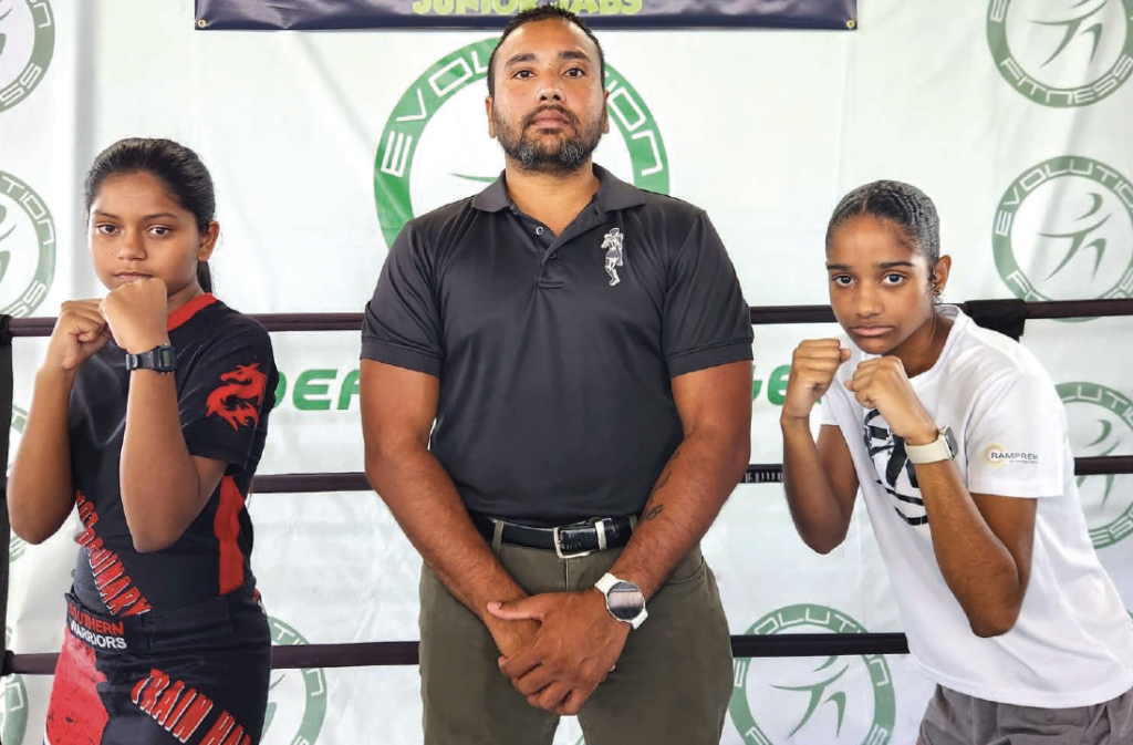 Kickboxing promoter and coach Jason Ramoutar, middle, along with Sonia Baboolal, left,
of Southern Warriors and Adriana Singh of TKB.