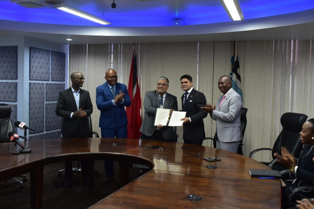 Chairman of WASA Ravindra Nanga, centre left, and chairman of LATT Neil Mohammed, centre right, display the signed memorandum of agreement between WASA and LATT at the WASA headquarters, St Joseph on April 16. Looking on is chairman of WASA Alston Fournillier, second right, and chief executive officer (ag.) of LATT Swedaka Matthews, left. - Photo courtesy WASA