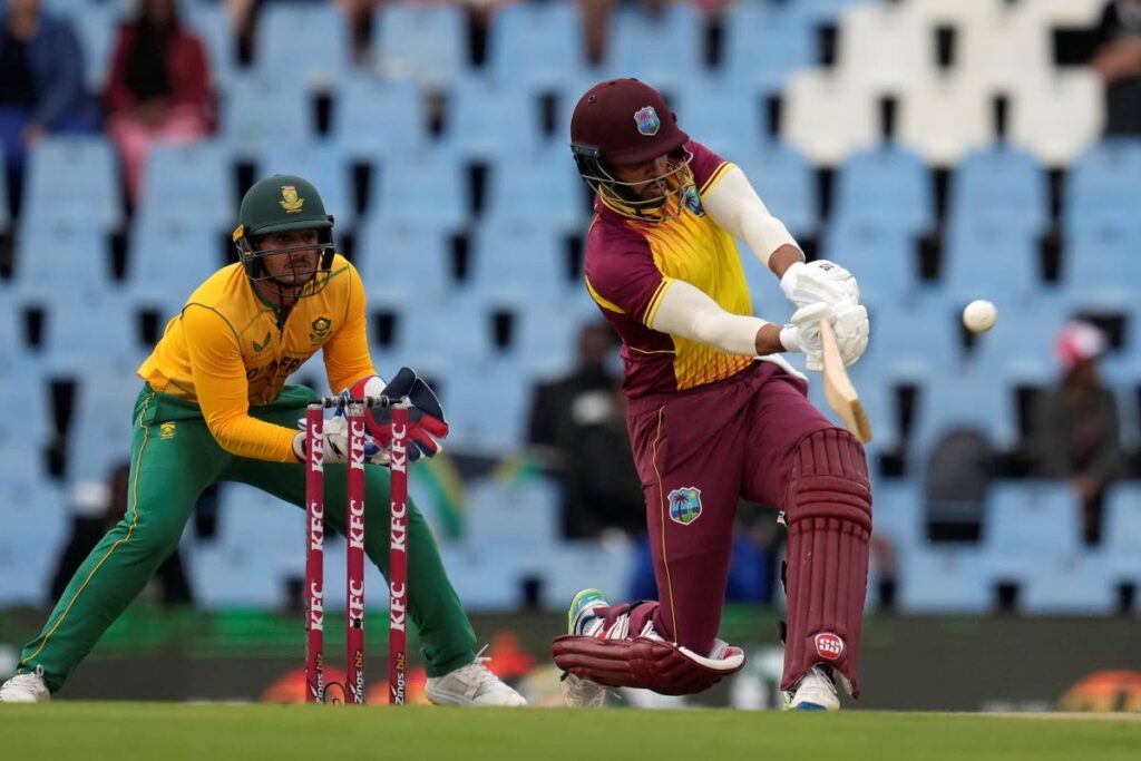 In this March 23, 2023 file photo, West Indies's batsman Brandon King plays a shot as South Africa's wicketkeeper Quinton de Kock watches on during the first T20, at Centurion Park, in Pretoria, South Africa.  - AP PHOTO