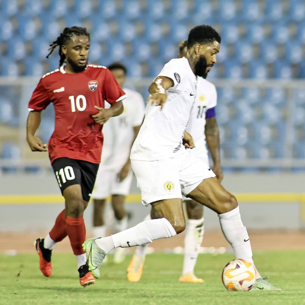 In this file photo, TT midfielder Duane Muckette  (L) vies for possession of the ball against Curacao during the Concacaf Nations League match, on September 7, 2023 at the Hasely Crawford Stadium, Port of Spain. TT won 1-0. - TTFA Media