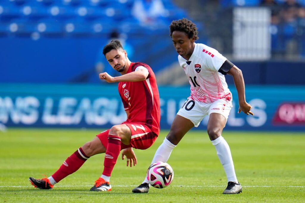 In this file photo, Canada midfielder Stephen Eustaquio, left, and TT midfielder Real Gill, right, compete for the control of the ball in the second half of a Concacaf Nations League Play-In match, on March 23, 2024, in Frisco, Texas. - AP PHOTO