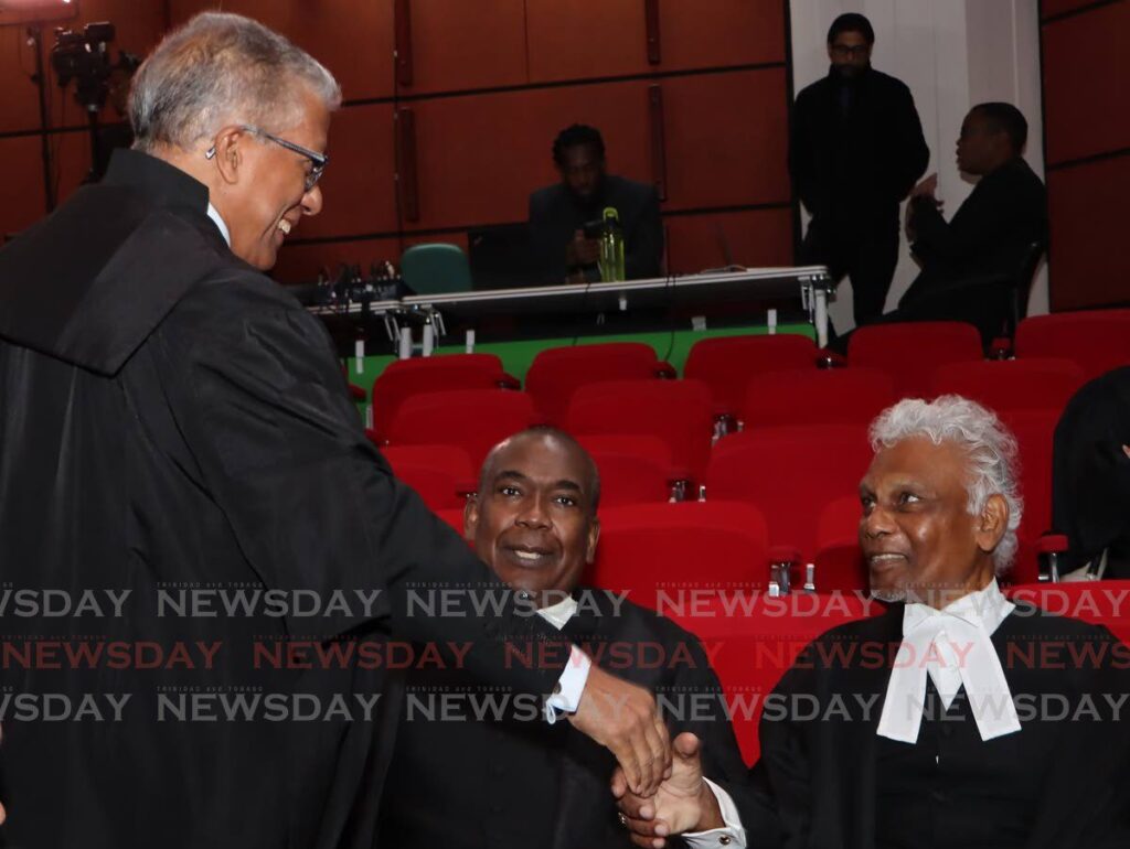 Attorney General Reginald Armour, SC, left, greets former attorney general John Jeremie, SC, centre, and Israel Khan, SC, during a joint sitting at the Hall of Justice on April 12 to pay tribute to late former chief justice Michael de la Bastide.  - Photo by Angelo Marcelle