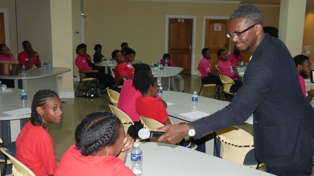 American filmmaker Mason Richards interacts with participants from the St James Police Youth Club during the screenwriting masterclass.
 - 