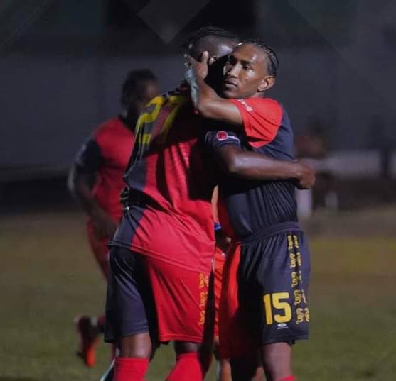AC PoS playmaker John-Paul Rochford (R) scored his team’s opening goal against Phoenix FC during the TT Premier Football League match, on Wednesday, at the Arima Velodrome.  - 