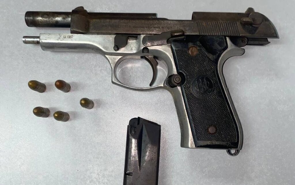 A gun and ammunition seized in anti-crime exercises. - Photo courtesy TTPS