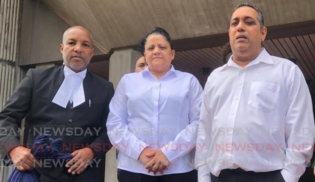 Attorney Sean Cazabon and his clients Roland Singh and Coreen Ortiz Bisram at the Hall of Justice, Port of Spain, on April 30. - Photo by Jada Loutoo