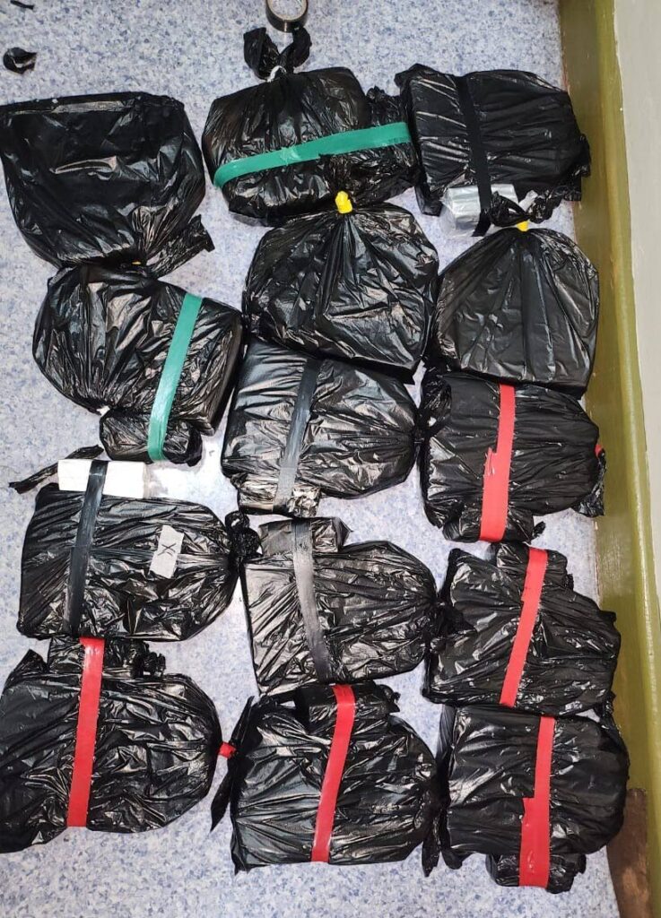 Black plastic bags of cigarettes and two pounds of marijuana recovered by Arima police officers during an intelligence-led police exercise at Swift Drive, Bon Air Gardens, Arima. Photo courtesy the TTPS. - 