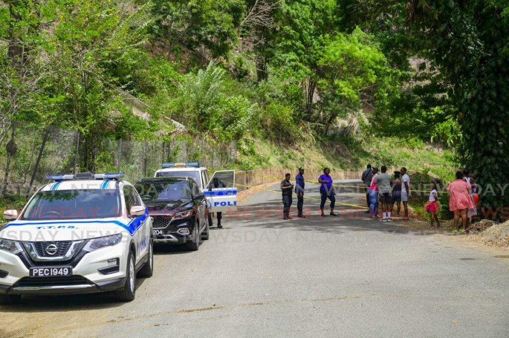 Police at the scene where the body of a woman was found off a precipice at Mt St George, Tobago on May 4.  - Photo by Caswell Gordon 