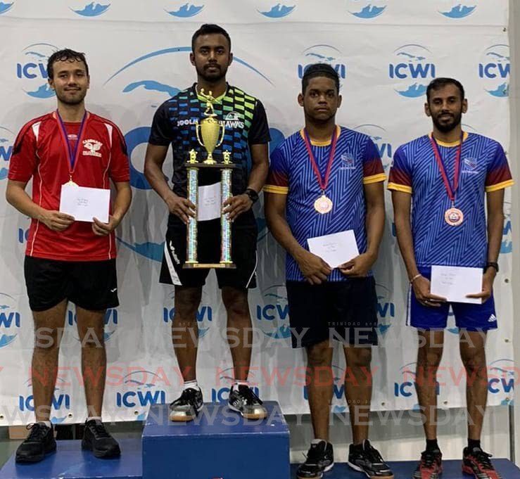 Arun Roopnarine shows off his men's singles trophy alongside runner-up Luc O'Young, left, and joint third placed finishers Abraham Francis and Yuvraaj Dookram at the ICWI Table Tennis Tournament on May 5, 2024. - Courtesy TTTTA
