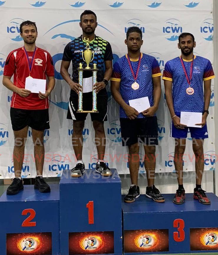 Arun Roopnarine shows off his men's singles trophy alongside runner-up Luc O'Young, left, and joint third placed finishers Abraham Francis and Yuvraaj Dookram at the ICWI Table Tennis Tournament on May 5, 2024. - Courtesy TTTTA