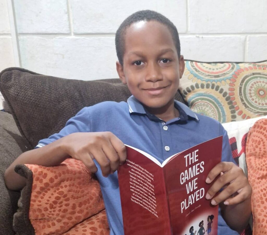 Nathan Fraser, 10, gives Carol-Ann Crossley's book The Games We Played a five-star rating.  - 