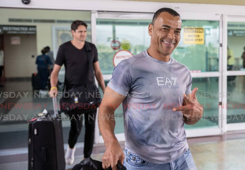 Brazil’s Fifa 2002 World Cup winners Cafu and Edmilson (background) arrive at the Piarco International Airport on May 9 ahead of the Legends of football match at the Hasely Crawford Stadium on May 10. - Photo by Jeff K Mayers