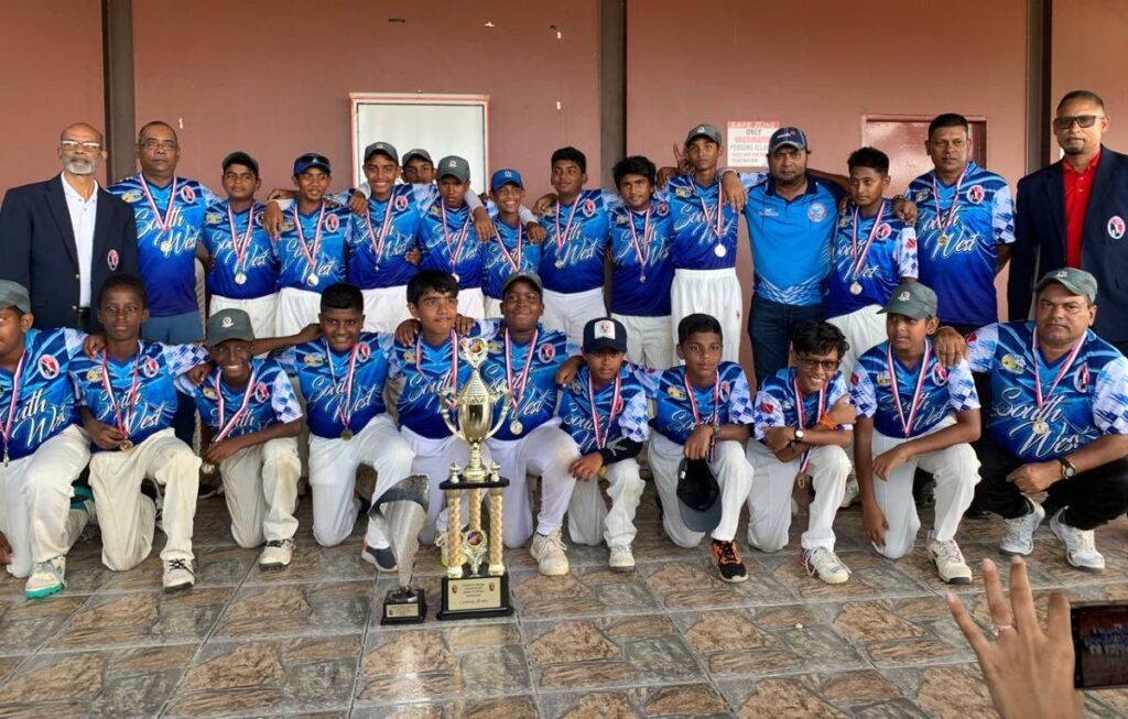 South West zone players and coaching staff after winning the TT Cricket Board (TTCB) Under-13 Interzone tournament at the National Cricket Centre in Couva, on May 9. Also in the picture are TTCB officials. - Photo courtesy TTCB